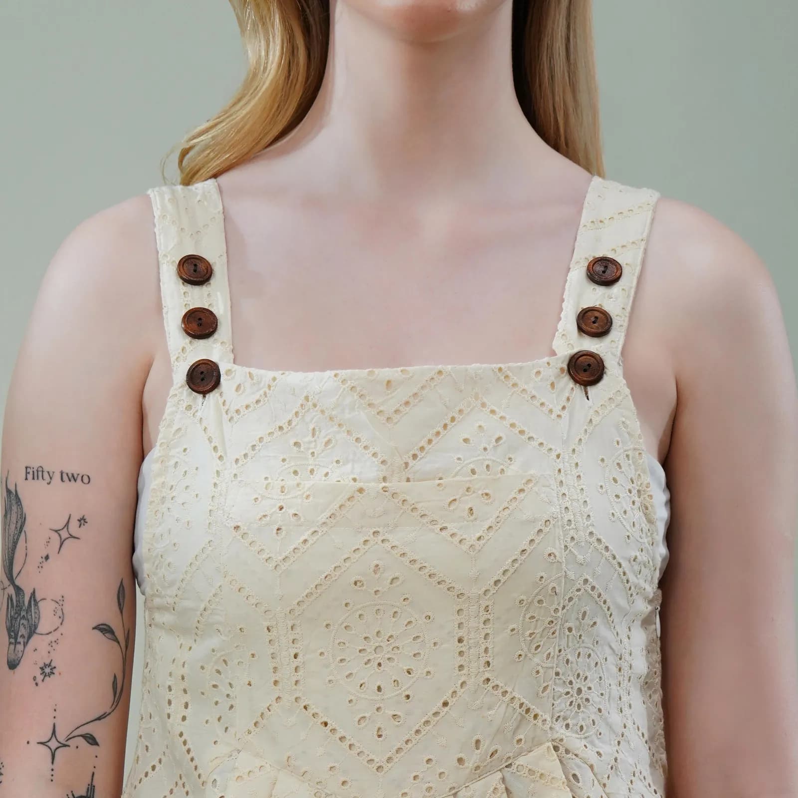 Vanilla Cotton Sleeveless Schiffli Jumpsuit with Scalloped Hem & Wooden Button Straps